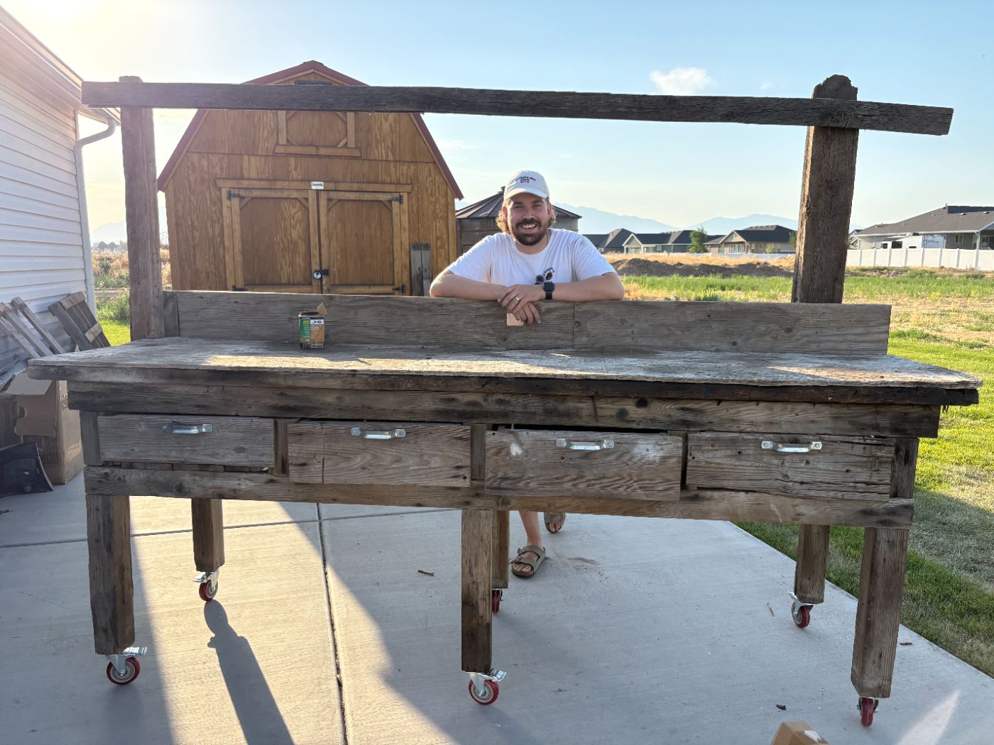 Dave leaning on the workbench with its new wheels installed