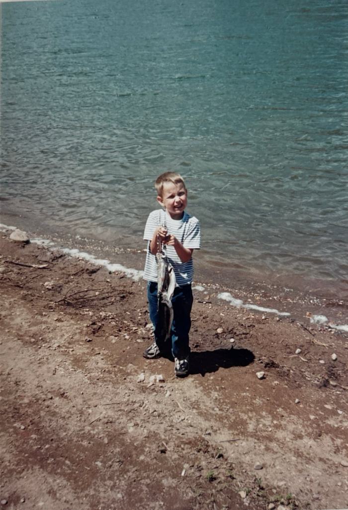 Young Dave on a Utah lakeshore holding a stringer of freshly caught trout